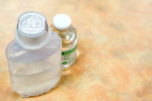 Top view of two injection bottle placed on a wooden table. photo