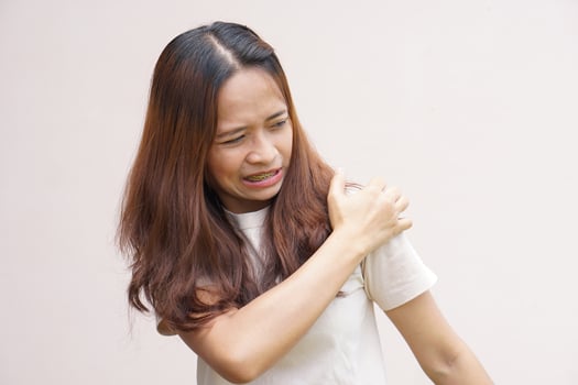 Asian woman having shoulder pain photo
