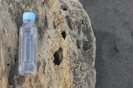 photo of a plain used bottle with daylight