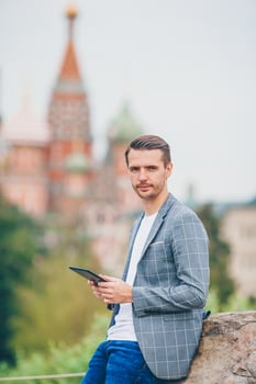 Happy young urban man in european city. photo