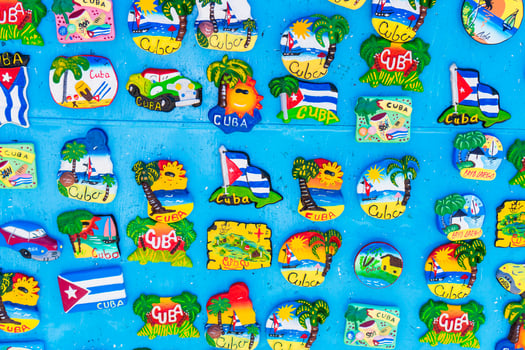 Magnetic board with souvenir magnets of Havana and Cayo Largo island at local market. photo