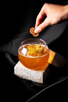 cocktail - infused gin with dried plum, infused dry vermouth with plum, drambuie, lime juice, syrup photo