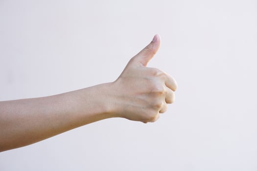 Asian woman hand making awesome sign photo