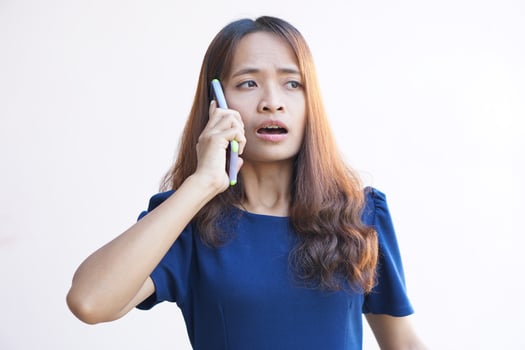 Businesswoman talking on the phone with customers happily because of reaching a mutual investment agreement photo