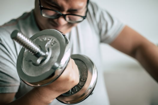 Funny fat man workout with dummbell photo