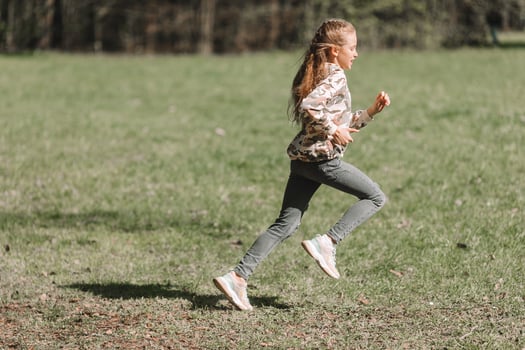 Little girl in outdoor park on her weekend photo