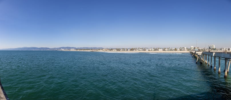 View from Santa Monica Pier over Venice beach in Los Angeles during daytime photo