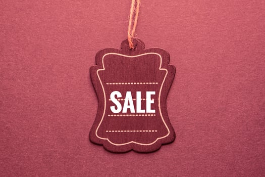 red price tag with sale sign on the red background, red mockup photo