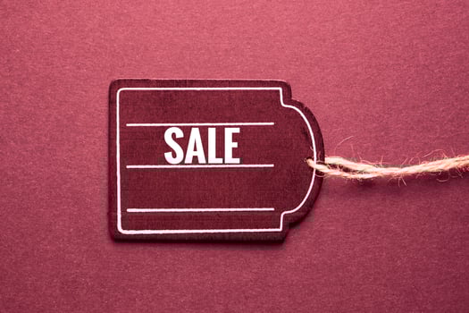 red price tag with sale sign on the red background, red mockup photo