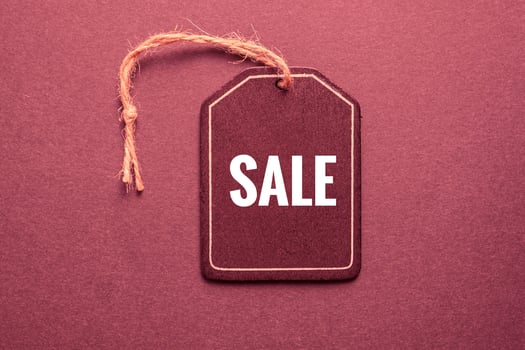 red price tag with sale sign on the red background, red mockup photo
