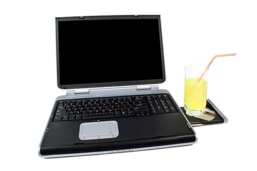 The laptop and cocktail. Isolated on white background photo