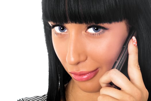 Portrait of the beautiful girl speaking on the phone photo