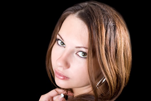 portrait of the young beauty woman. Isolated on black photo