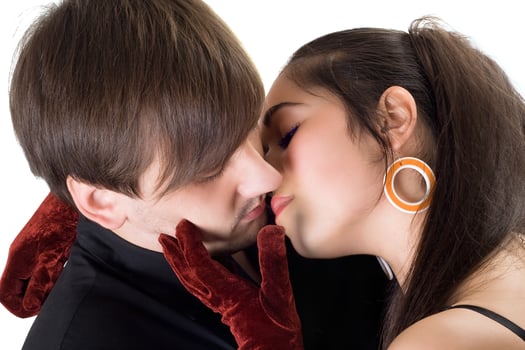 Portrait of the kissing young couple. Isolated photo