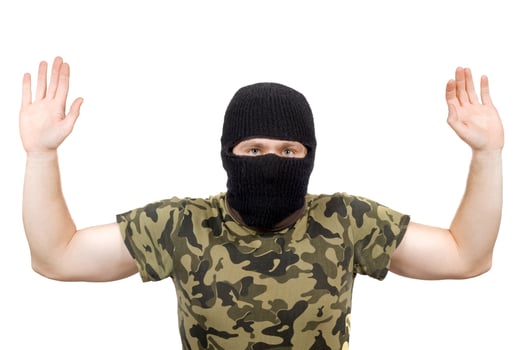 The surrendered criminal in a black mask over white photo