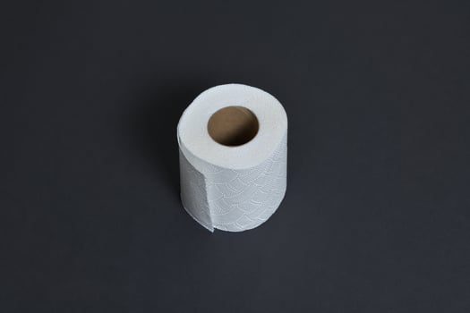 Toilet paper isolated on black background photo