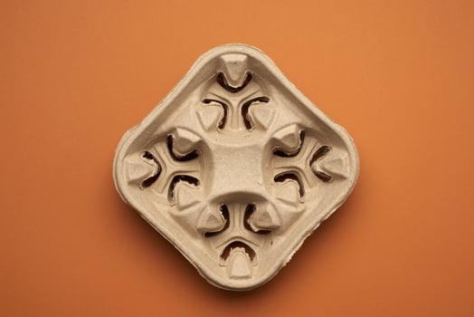 paper tray for drinks in takeaway cups on four cups  on a brown background photo