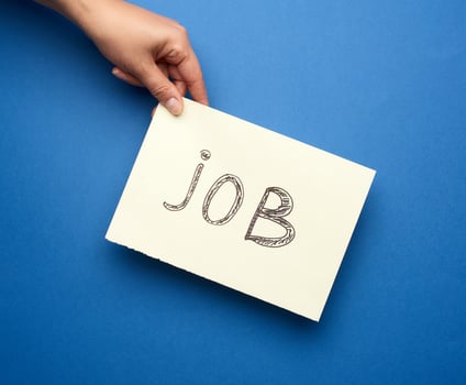 piece of paper with the inscription job, concept of unemployment photo