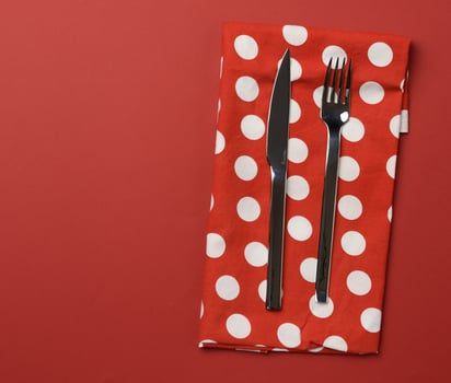 metal fork and knife , red background photo