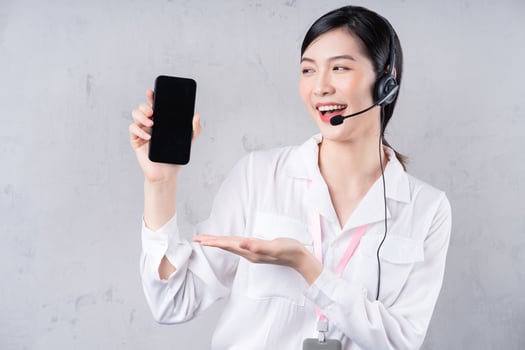 Portrait of young Asian operator on background photo