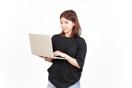 Happy face while using laptop Of Beautiful Asian Woman Isolated On White Background photo