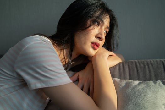 Image of young Asian woman at home photo