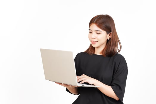 Happy face while using laptop Of Beautiful Asian Woman Isolated On White Background photo