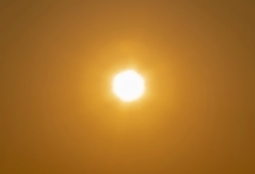 The sun on the yellow sky photo