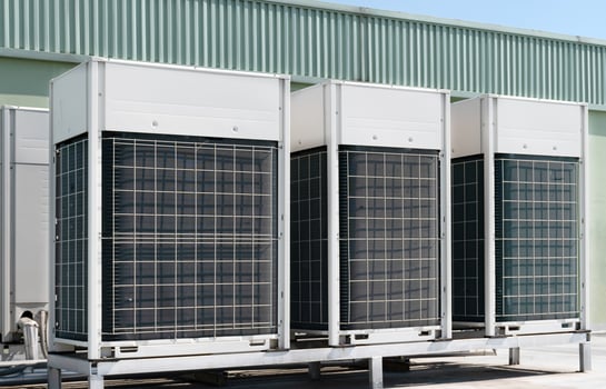 Compressors, air conditioners on the roof of the office building photo