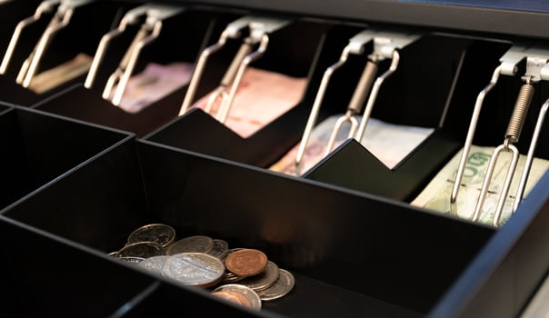Thai bank notes and coins are in the cashier machine photo
