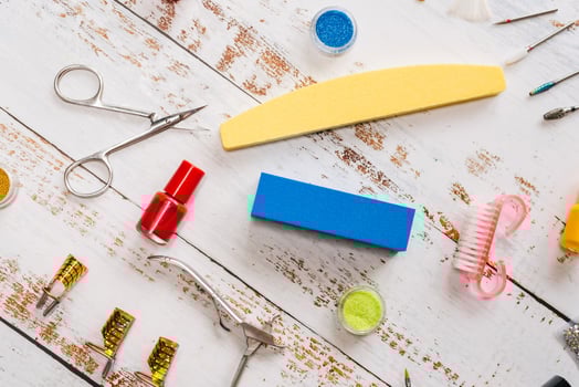 manicure tools, sequins, nail polishes. the view from the top photo