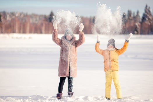 Family of mom and kid vacation on Christmas eve outdoors photo