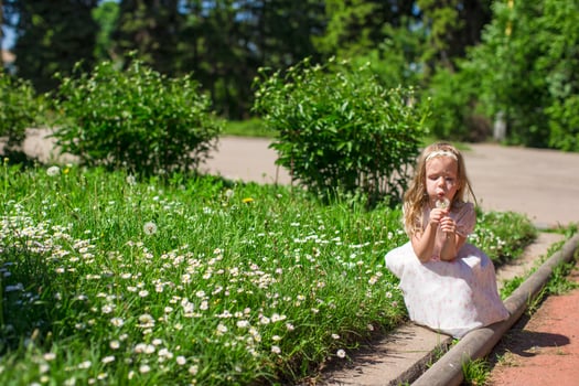 Little girl with beautiful flowers photo