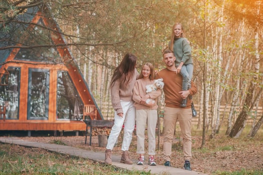 Beautiful family walking at autumn warm day photo