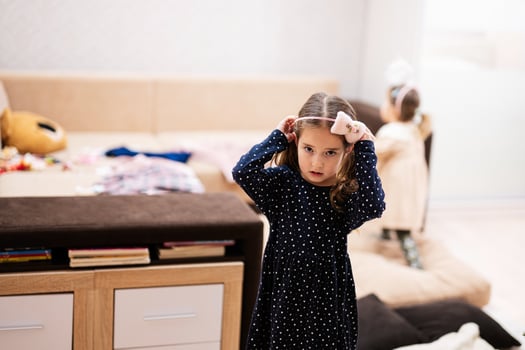 Girl wears a hoop on her head at home. photo