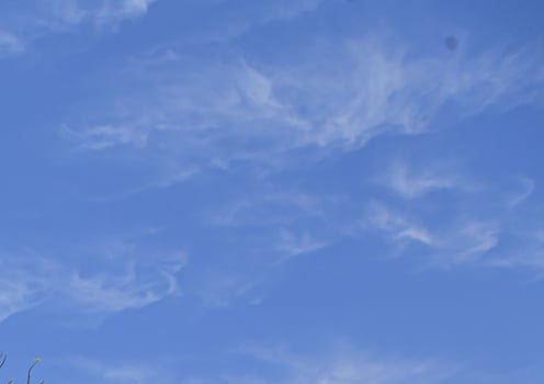 Image of a partly cloudy and partly clear sky during the day photo