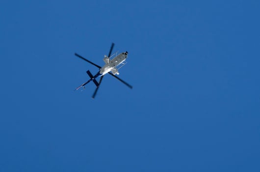 Helicopter against the blue sky on a sunny day photo