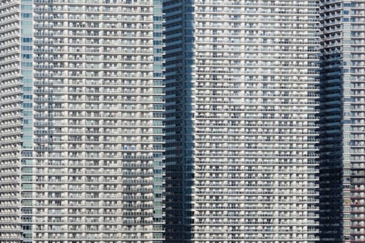 Dense urban living in a row of skyscrapers in Tokyo, Japan photo