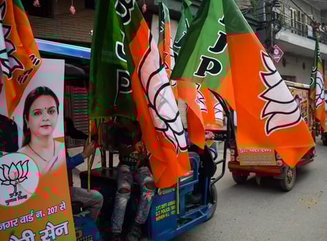 Delhi, India, December 02 2022 - Bharatiya Janata Party BJP supporter during mega road show in support of BJP candidate Pankaj Luthara to file nomination papers ahead of MCD local body Elections 2022 photo
