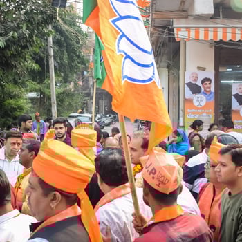 Delhi, India, December 02 2022 - Bharatiya Janata Party BJP supporter during mega road show in support of BJP candidate Pankaj Luthara to file nomination papers ahead of MCD local body Elections 2022 photo