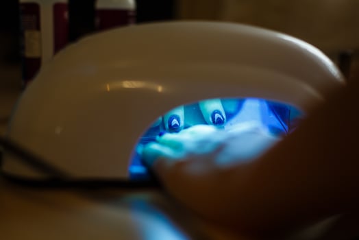 Uv lamp for attaching plastic nails with gel method photo