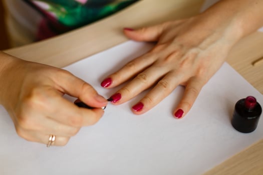 A woman doing manicure focus on her hands photo