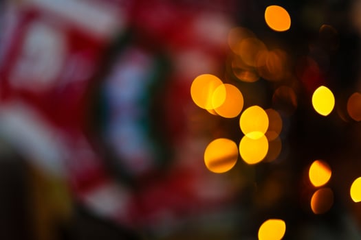 Christmas decoration of fireplace and fir tree in living room festive and blurred lights design photo