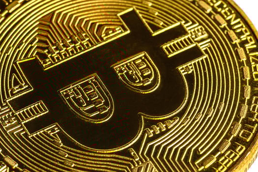 Golden bitcoin isolated on white background photo