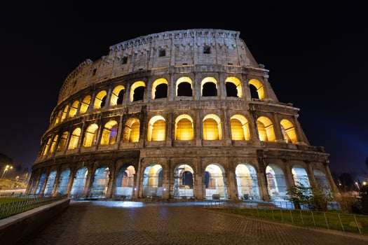 rome, italy, colosseum old ancient building gladiator battle at night. photo