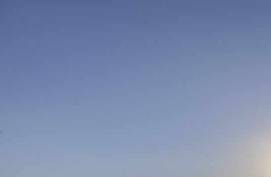 Image of a clear and cloudless sky can be used as background photo