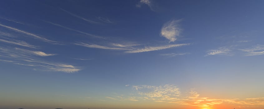 Picture of dramatic and colorful sky with sun during sunset photo