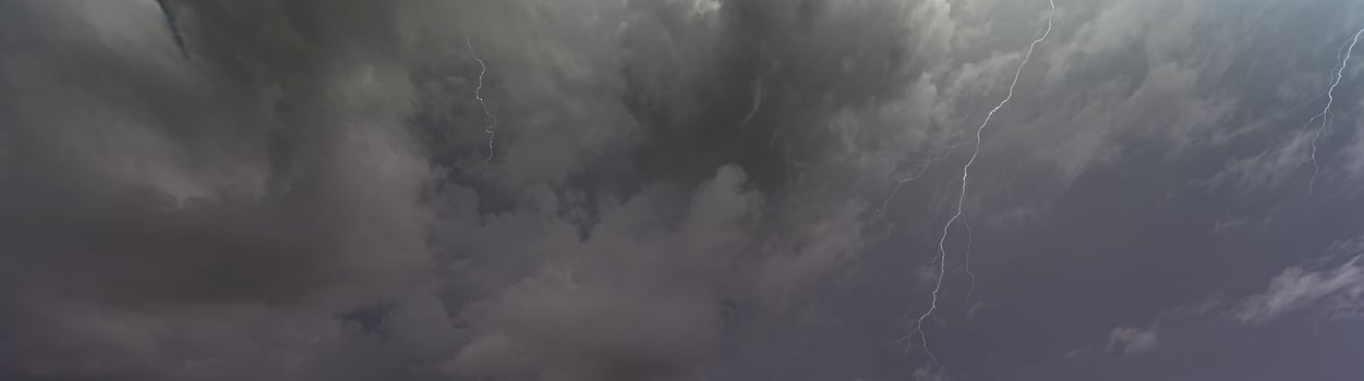 Picture of a flash in the night sky with glowing clouds photo