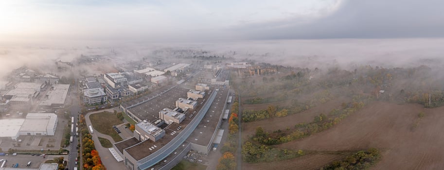 Drone image of the industrial area of the southern Hessian town of Moerfelden-Walldorf in autumn with ground fog photo
