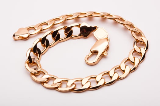 close-up gold bracelet jewelry, chain on hand photo